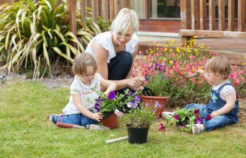 Professional landscapers assessing a reported problem