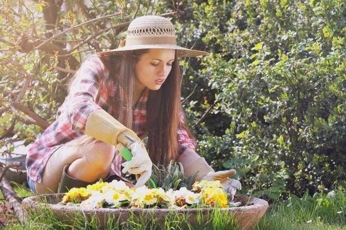 Professional landscapers shaping an outdoor space in Northolt